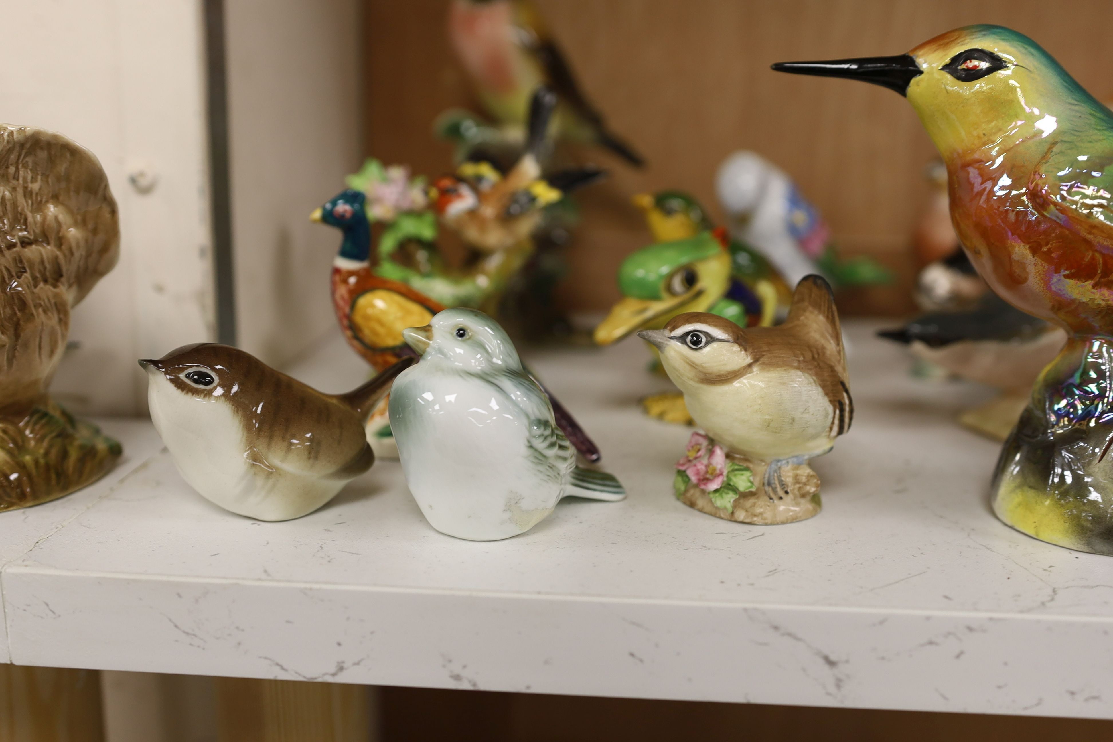 A large collection of ceramic bird figures including Beswick, Russian models, Karl Ens etc